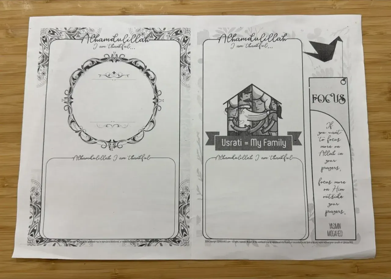 Two Alhamdulillah gratitude journal pages from 2018, one with an ornate frame and one titled Usrati = My Family, beside a bookmark quoting Yasmin Mogahed